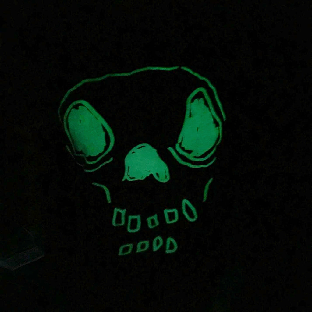 Green glowing skeleton head art piece.
