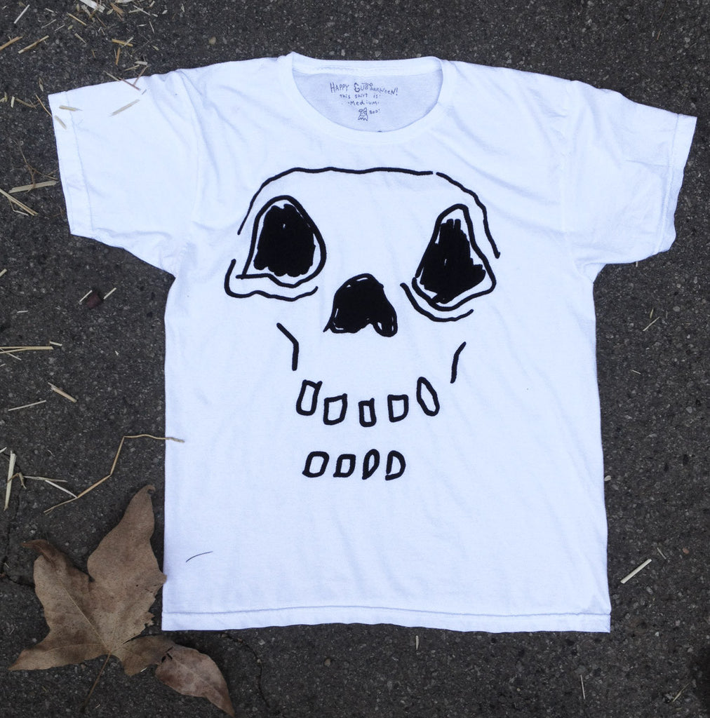 Hand-drawn skeleton on white t-shirt.