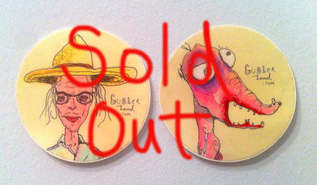 Picture of a pair of stickers side by side with Gubler paintings on them. Large hand-written text over image that says “Sold Out”.